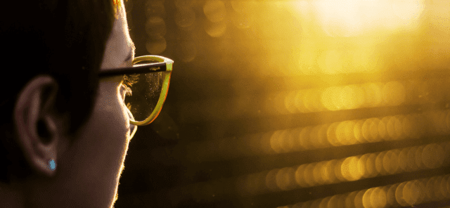 Woman looking into the sunlight